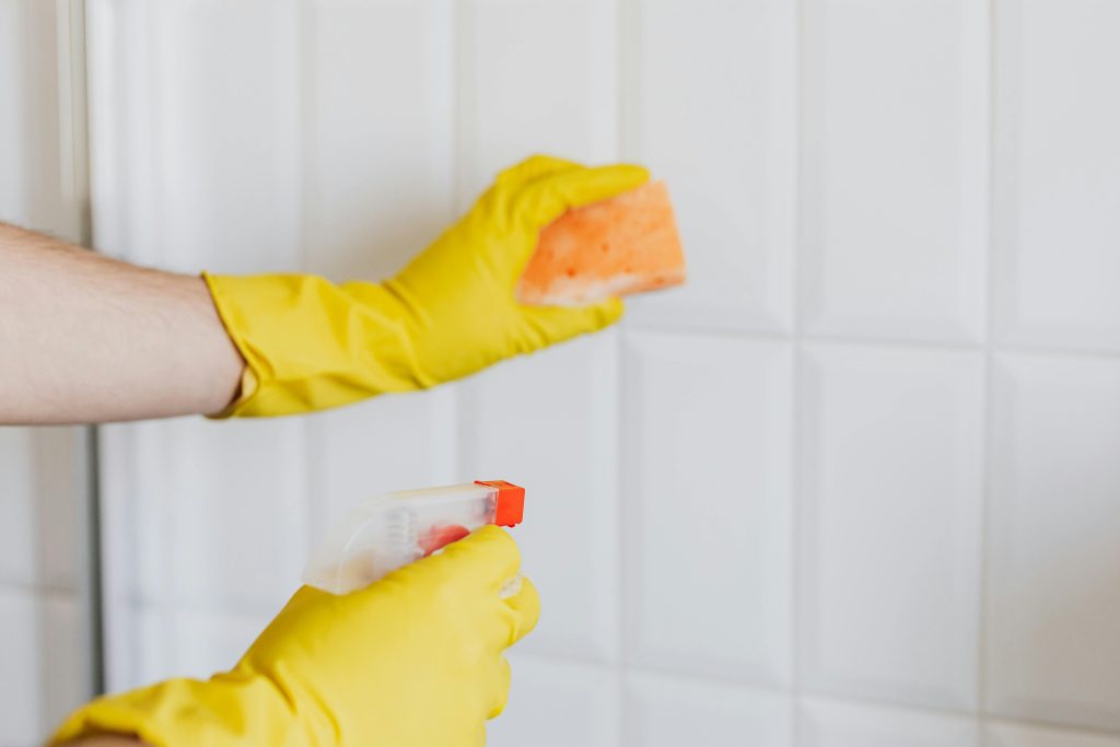 Gloved hands Cleaning Walls